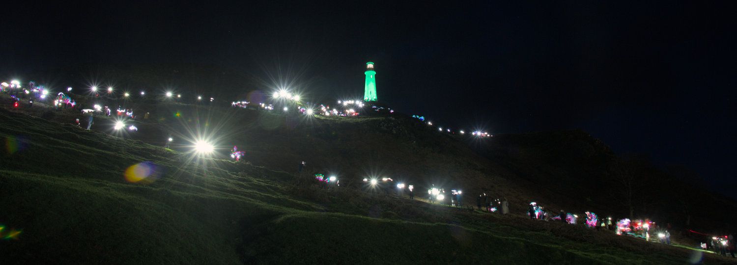 A view of people's lights on leading up Hoad Hill